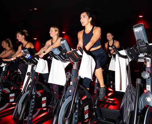 People rinding Indoor Cycles